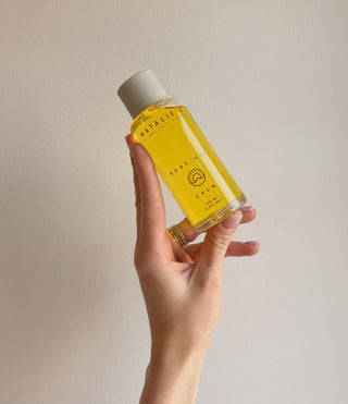 Calm Body Oil held in hand