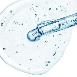 A large drop of hyaluronic acid coming out of a pipette