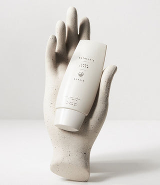 Repair hand cream held synthetic hand