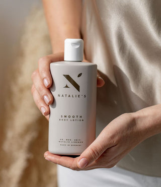 Smooth body lotion held in hands