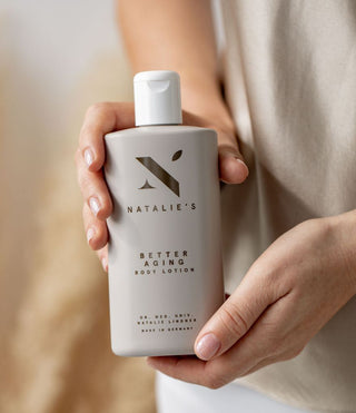 Better Aging body lotion held in hands