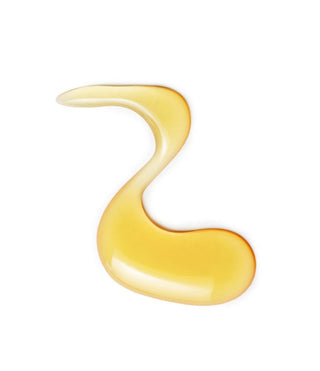 A drop of our better aging body oil in "S" shape
